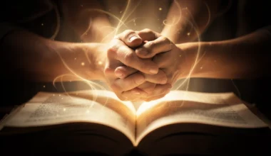 35 powerful prayers for my husband: clasped hands bathed in divine light from an open book.